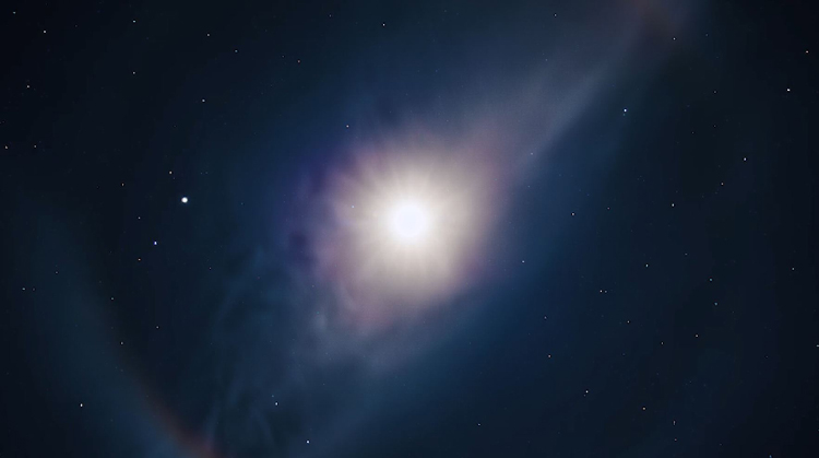 The color spectrum of a moonbow is moody and majestic– from violets and blues to greens.